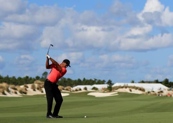 Tiger Woods plays a shot on the third hole en route to a closing four-under 68 on his return to action in the Hero World Challenge in the Bahamas. Picture: Getty Images