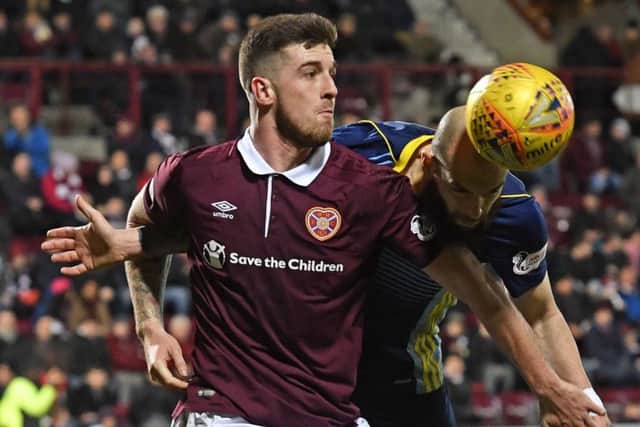 Cole Stockton (left) battles for possession with Hamilton's Georgios Sarris during the 1-1 draw at Tynecastle. Picture: SNS