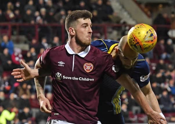 Cole Stockton (left) battles for possession with Hamilton's Georgios Sarris during the 1-1 draw at Tynecastle. Picture: SNS