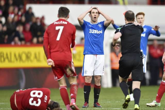 Rangers' Ryan Jack (centre) is sent off by referee Willie Collum. Picture: SNS