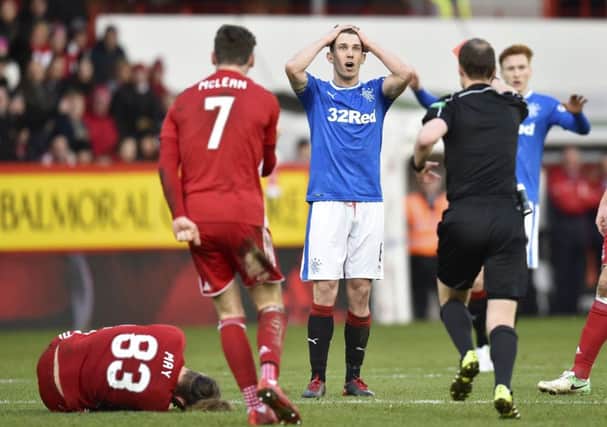 Rangers' Ryan Jack (centre) is sent off by referee Willie Collum. Picture: SNS
