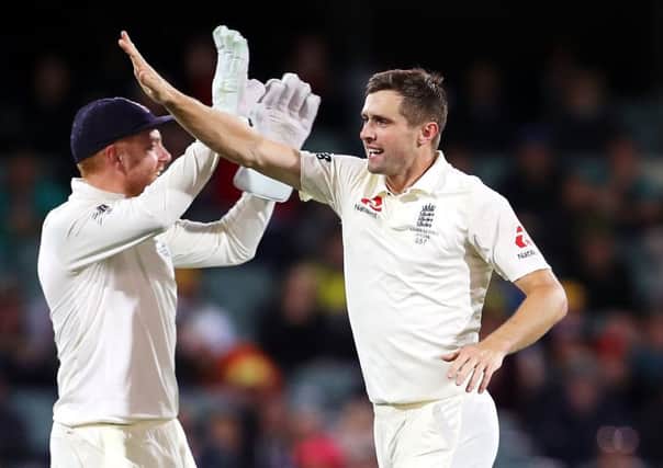 England's Chris Woakes celebrates taking the wicket of Steve Smith. Picture: Mark Kolbe/Getty Images