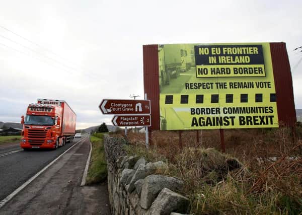 A poster calling for no hard border between North and South on the road between Newry and Dundalk. (Picture: AFP/Getty)