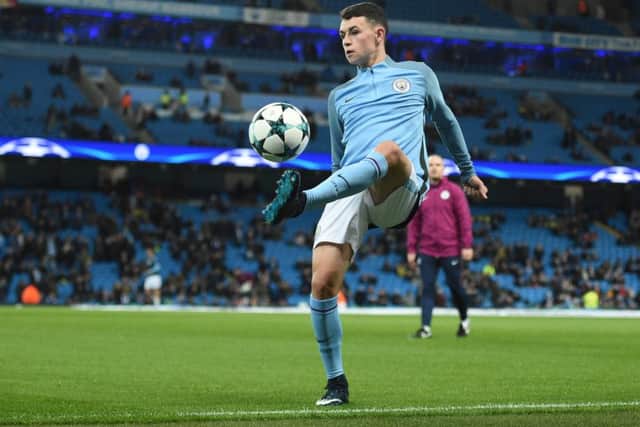 Phil Foden warms up ahead of the Champions League match agianst Feyenoord. Picture: Getty Images/Oli Scarff