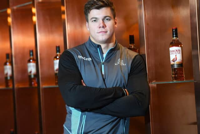 Glasgow centre Huw Jones helps promote the club's new two-year sponsorship deal with The Famous Grouse. Picture: SNS/SRU