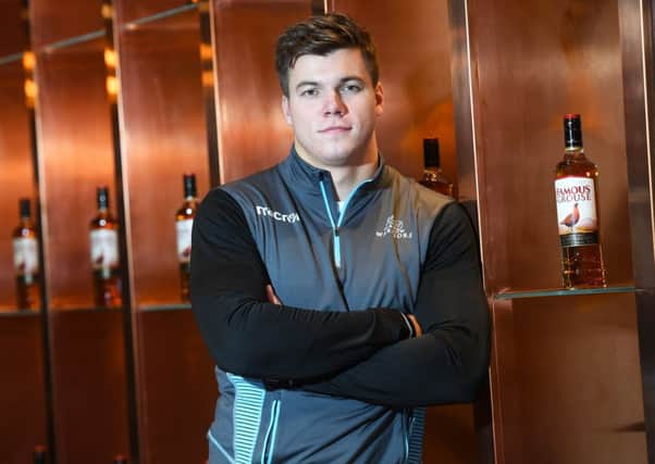 Glasgow centre Huw Jones helps promote the club's new two-year sponsorship deal with The Famous Grouse. Picture: SNS/SRU