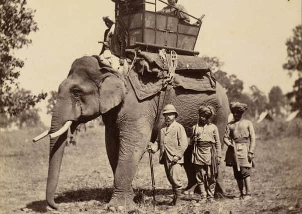 The Prince stands by an elephant during his tour of India. Picture: Royal Collection