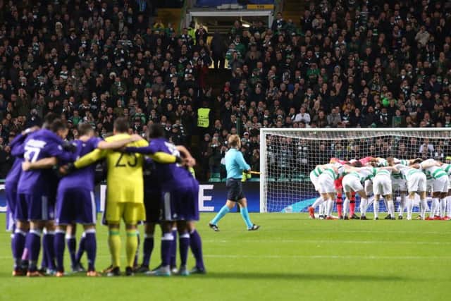 A mirror image at Celtic Park as Celtic and Anderlecht form huddles pre-match. Picture: PA