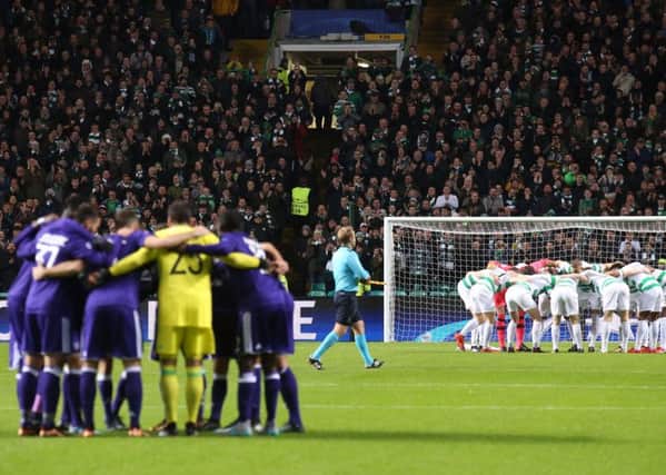 A mirror image at Celtic Park as Celtic and Anderlecht form huddles pre-match. Picture: PA