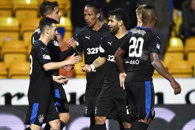 Rangers players celebrate after the 3-0 win in Perth. Picture: SNS