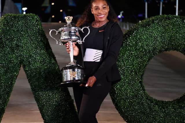 Serena Williams with the trophy after her victory against sister Venus in the 2017 Australian Open womens singles final in Melbourne. Picture: Saeed Khan/AFP/Getty Images