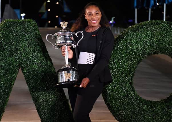 Serena Williams with the trophy after her victory against sister Venus in the 2017 Australian Open womens singles final in Melbourne. Picture: Saeed Khan/AFP/Getty Images