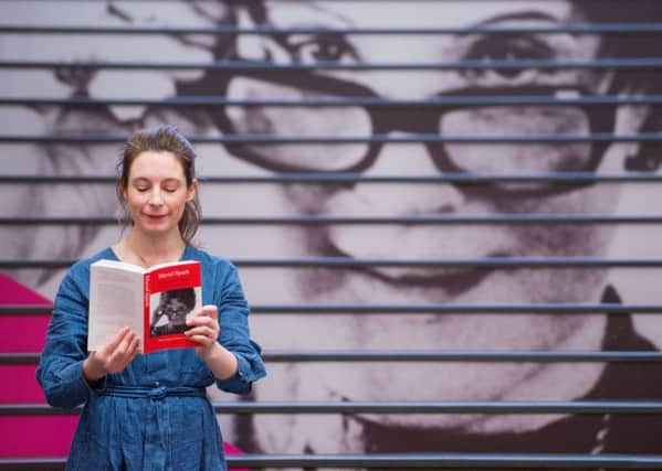 National Library of Scotland exhibitions officer Ciara McKenna was brushing up on her Muriel Spark ahead of todays opening of an exhibition about the author. Picture: TSPL