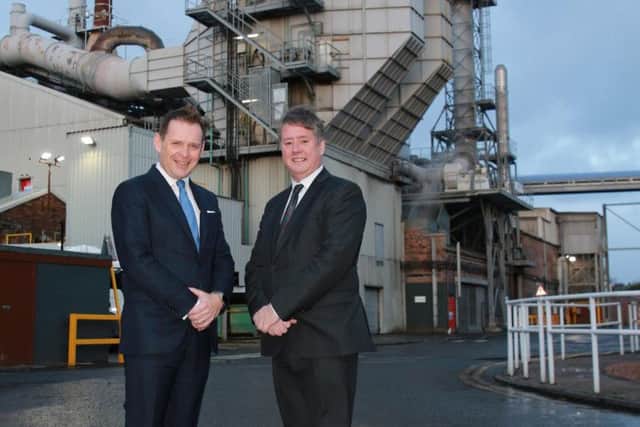 Ken Munro, chief executive of TechnoNicol UK, Ireland and USA, and economy secretary Keith Brown. Picture: Stewart Attwood.