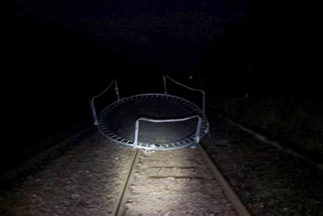 A trampoline on the train tracks between Glasgow and Neilston, East Renfrewshire. Picture: SWNS