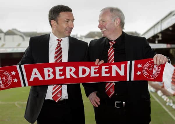 Derek McInnes, left and Aberdeen chairman Stewart Milne were all smiles when the former St Johnstone and Bristol City boss took over as Pittodrie manager in March 2013. Picture: Bill Murray/SNS