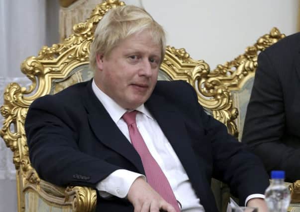 British Foreign Secretary Boris Johnson, during his meeting with Secretary of Iran's Supreme National Security Council Ali Shamkhani,  in Tehran, Iran, Saturday, Dec. 9, 2017 (AP Photo/Vahid Salemi)
