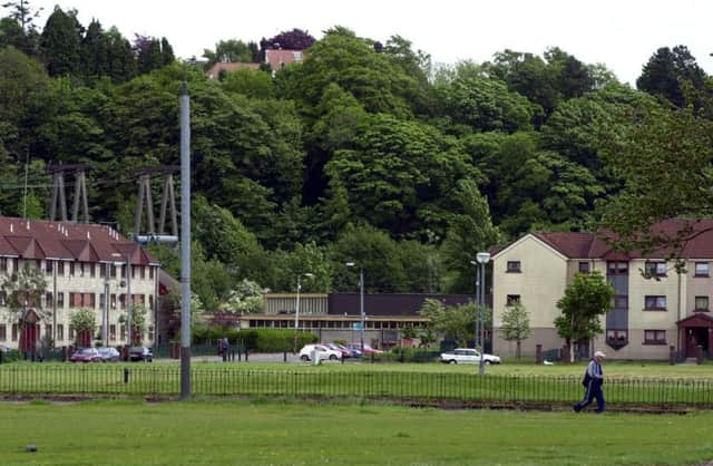 The Drumchapel estate, with the edge of Bearsden looking down from the trees above. Life expectancy between the two is markedly different. Picture: Robert Perry