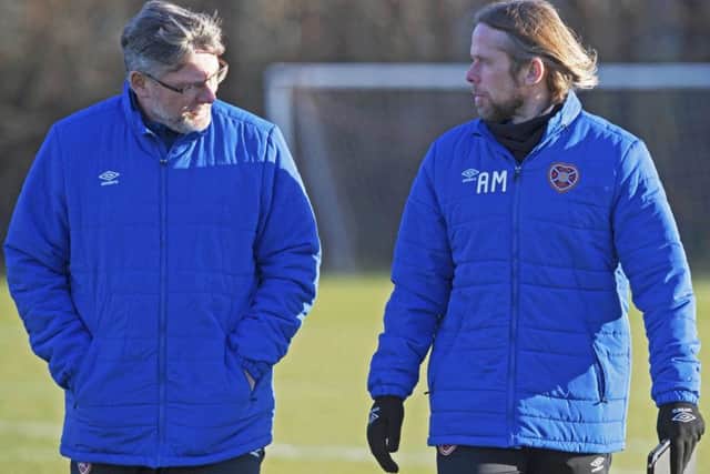 Hearts manager Craig Levein, left, talks with assistant Austin MacPhee during training ahead of todays home clash with Motherwell. Picture: SNS.