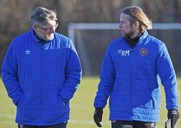 Hearts manager Craig Levein, left, talks with assistant Austin MacPhee during training ahead of todays home clash with Motherwell. Picture: SNS.