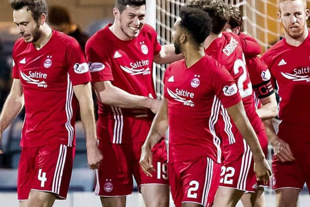 Scott McKenna celebrates scoring the only goal of the game - his first for Aberdeen. Picture: SNS Group