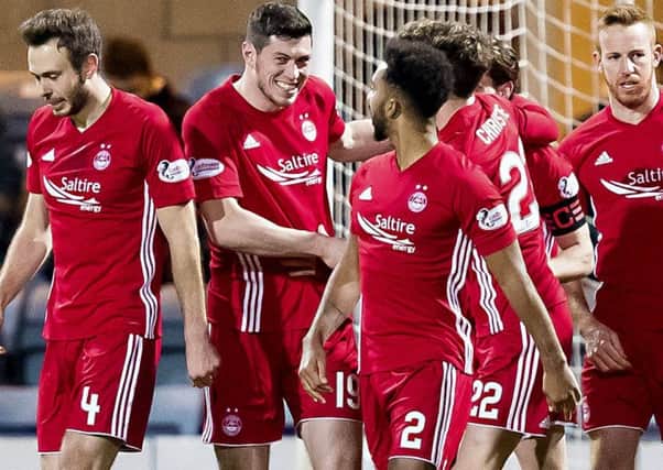 Scott McKenna celebrates scoring the only goal of the game - his first for Aberdeen. Picture: SNS Group