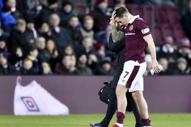 Jamie Walker goes off with an injury. Picture: SNS