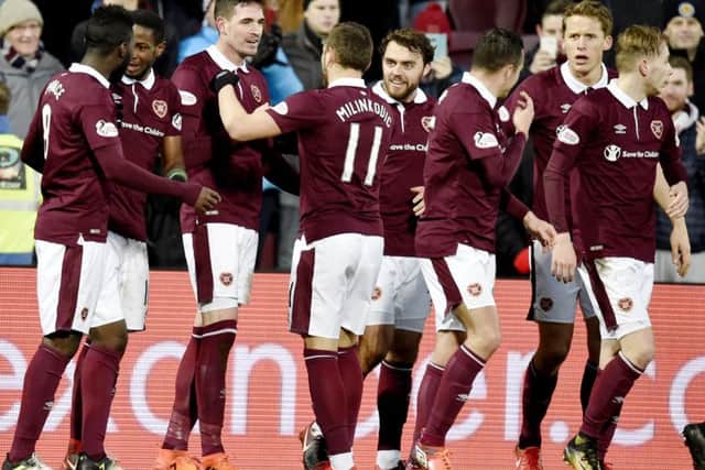 Kyle Lafferty celebrates with his Hearts team-mates after opening the scoring. Picture: SNS