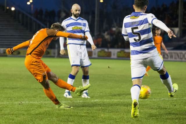 Dundee Uniteds Billy King (left) scores his first of two to put his side in front after an hours play. Photograph: Bruce White/SNS
