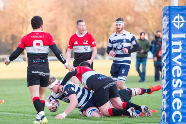 Adam Sinclair crashes over for a try for Heriot's against Hawks. Picture: Ian Georgeson