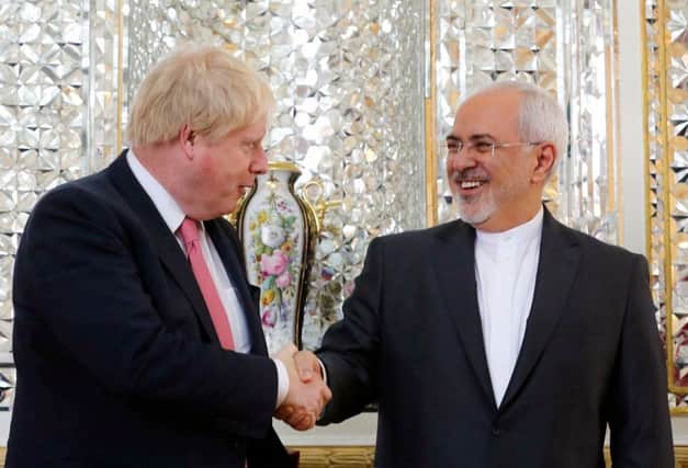 Boris Johnson shakes hands with the Iranian foreign minister Mohammad Javad Zarif. Photograph: AFP/Getty