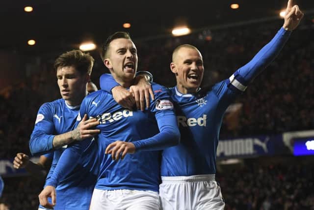 Rangers' matchwinner Danny Wilson is flanked by Josh Windass and captain Kenny Miller. Picture: SNS