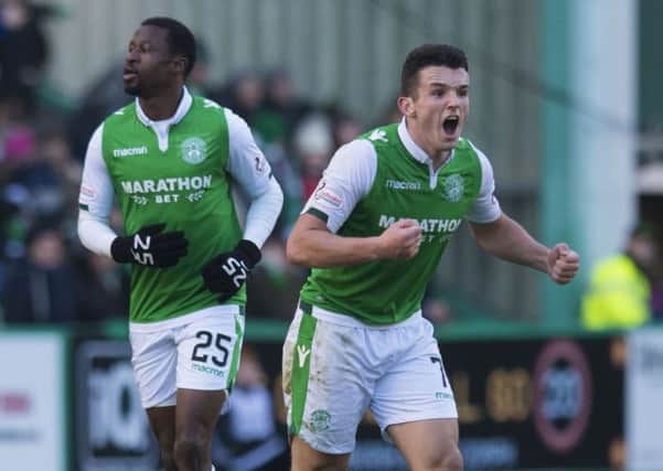 John McGinn shouts encouragement to his team-mates after Hibs pull a goal back at 2-1. Picture: SNS