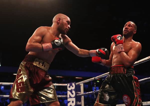 American Caleb Truax, left, lands a punch on his way to defeating Britain's James DeGale. Picture: Christopher Lee/Getty
