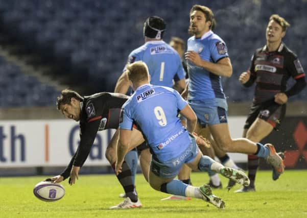 Edinburgh's Phil Burleigh touches down for the first of his two tries. Picture: SNS