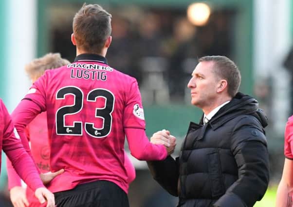 Brendan Rodgers thanks Mikael Lustig for the late goal-line clearance that prevented Hibs' Oli Shaw ending Celtic's unbeaten run. Picture: SNS