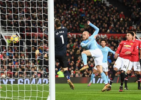 David Silva swivels to fire the ball beyond David de Gea for Manchester City's opening goal. Picture: Michael Regan/Getty
