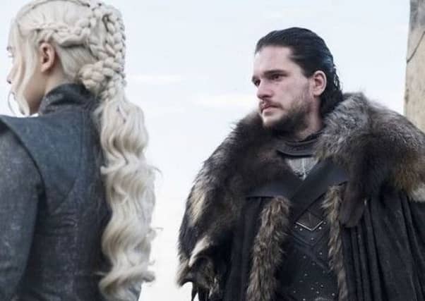Kit Harington was spotted helping people pack their Christmas trees.