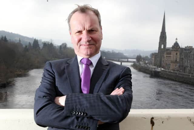 Pete Wishart, SNP MP and ex Runrig rock star in his local constituency of Perth.
 Picture: Chris Austin