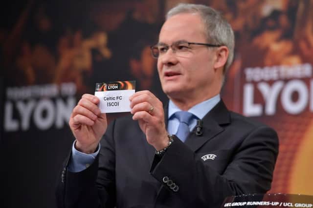 UEFA director of competitions Giorgio Marchetti shows the slip of Celtic during the Europa League Round of 32 draw. Picture: AFP/Getty