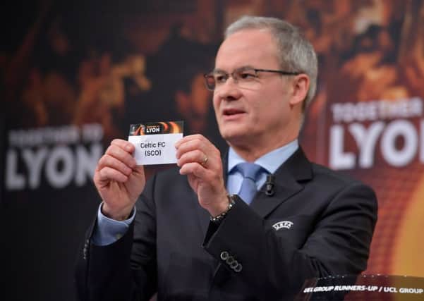 UEFA director of competitions Giorgio Marchetti shows the slip of Celtic during the Europa League Round of 32 draw. Picture: AFP/Getty