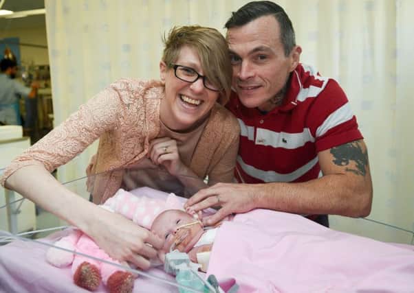 Naomi Findlay and Dean Wilkins spend precious time with daughter Vanellope Hope as she recovers from her life-saving operations, Picture: Ben Birchall/PA