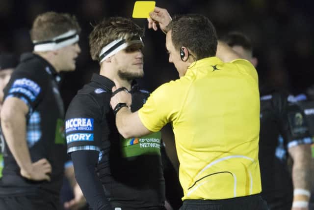 Glasgow hooker George Turner is shown a yellow card for an off-the-ball charge on Montpellier's Louis Picamoles. Picture: SNS