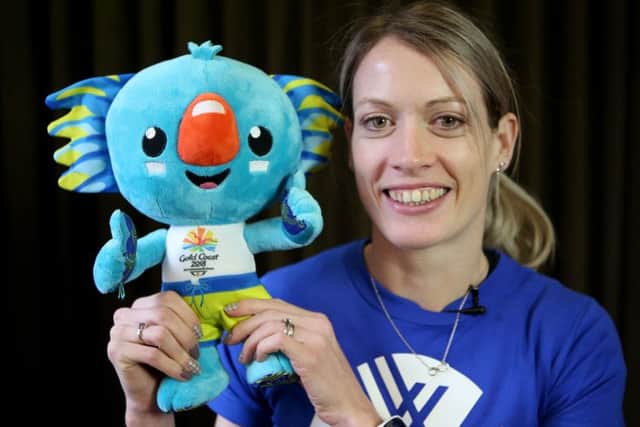 800m hurdler Eilidh Doyle with the Gold Coast Commonwealth Games mascot. Picture: Jane Barlow/PA Wire