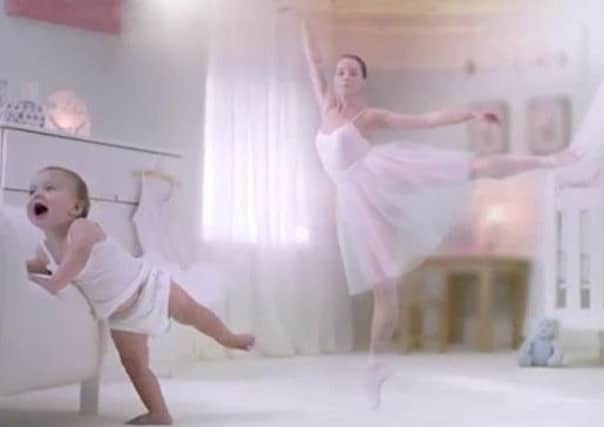 An advertisement for Aptamil baby formula shows a baby girl growing up to become a ballerina.