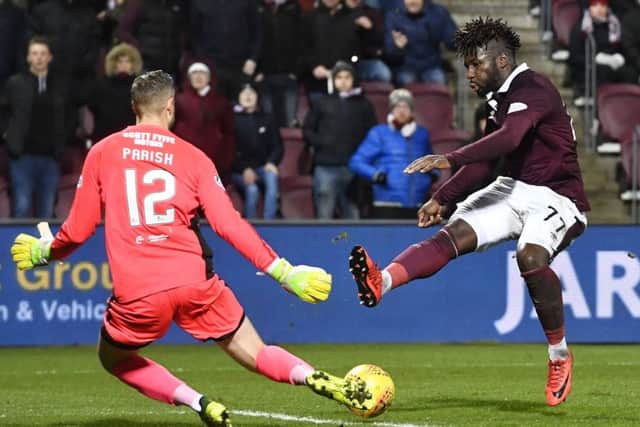 Esmael Goncalves slots the ball past Dundee keeper Elliot Parish to open the scoring for Hearts. Picture: Rob Casey/SNS