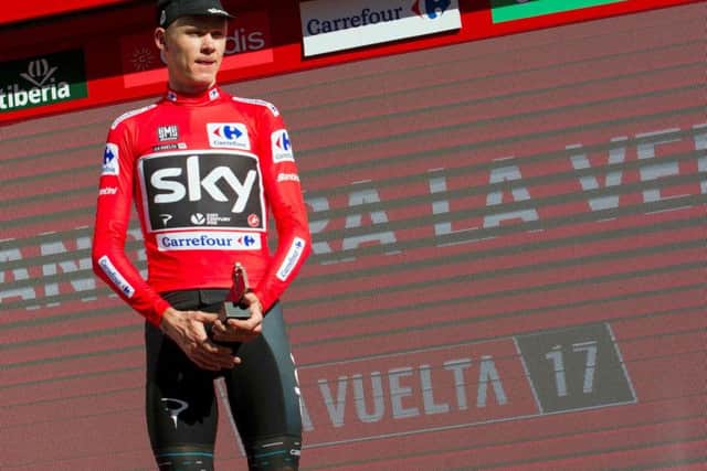 Chris Froome on the podium with the leader's red jersey at the end of the 3rd stage of La Vuelta in August 2017. Picture: AFP/Getty Images