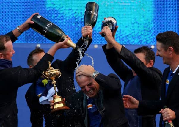 Team captain Paul McGinley is showered with champagne after leading Europe to Ryder Cup victory in the biennial event at Gleneagles in  2014.