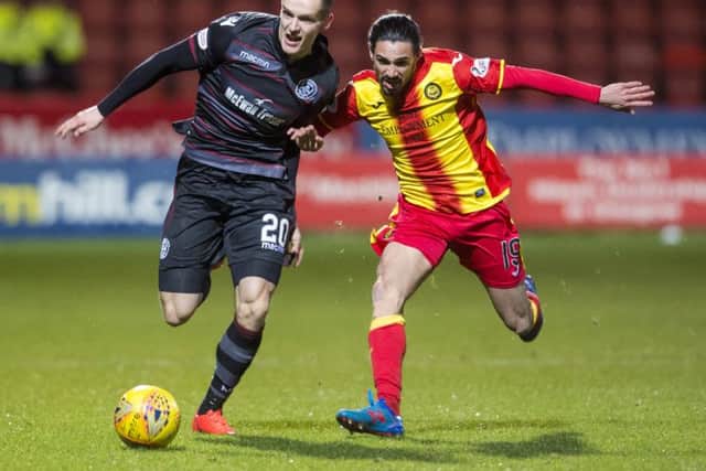 Deimantas Petravicius battles Partick Thistle's Ryan Edwards for possession. Picture: SNS