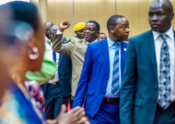 Zimbabwe's President Emmerson Mnangagwa arrives for the opening of the 107th annual conference of the Zanu-PF Central Committee. Picture: JEKESAI NJIKIZANA/AFP/Getty Images